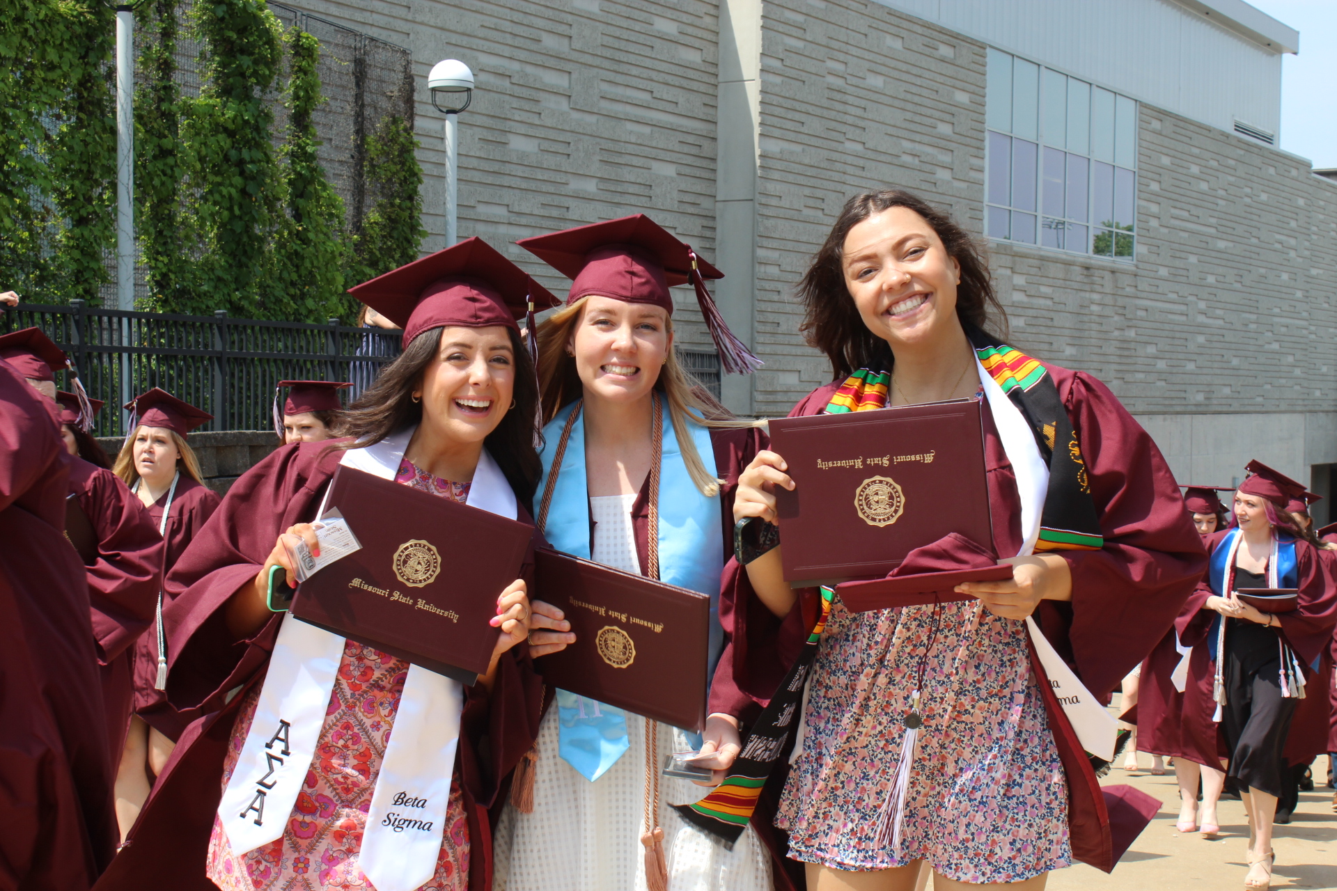 BearGrad Showing off their new diploma