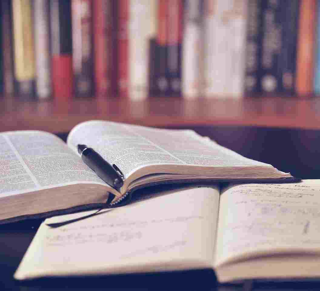 books laid open wiht pen inside